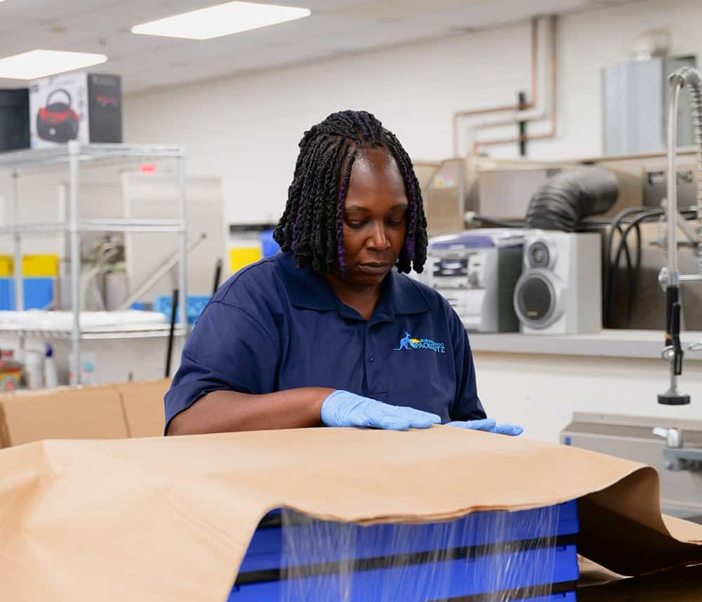 worker wrapping box