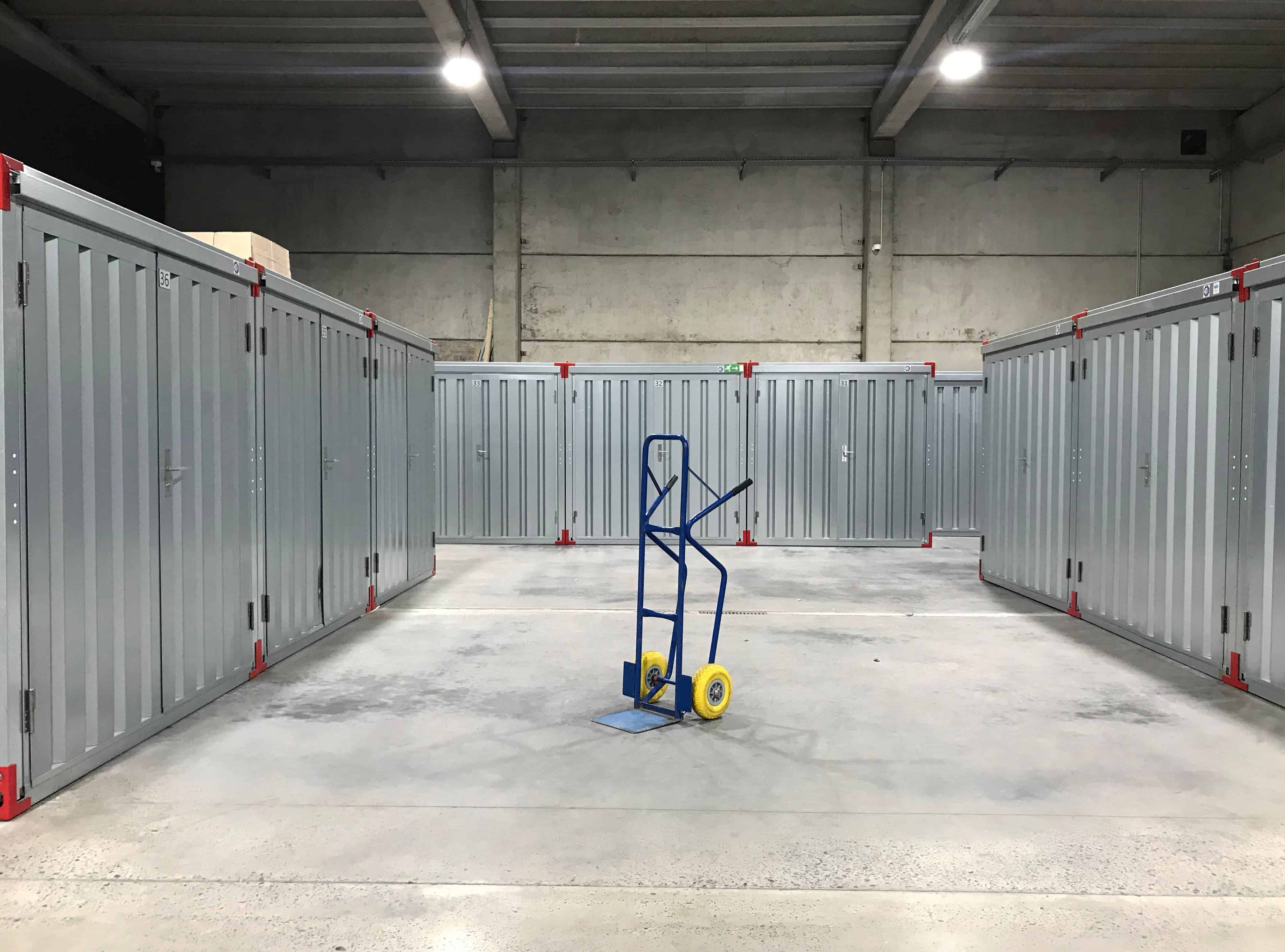 an empty dolly in an empty warehouse.