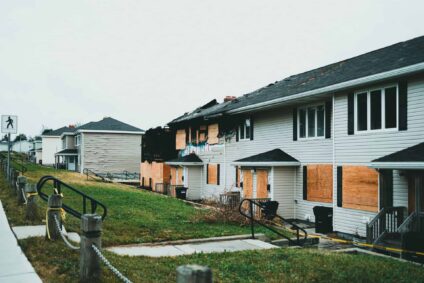 a row of homes damaged by fire.